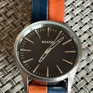 Nixon Silver Watch with Orange and Blue Strap